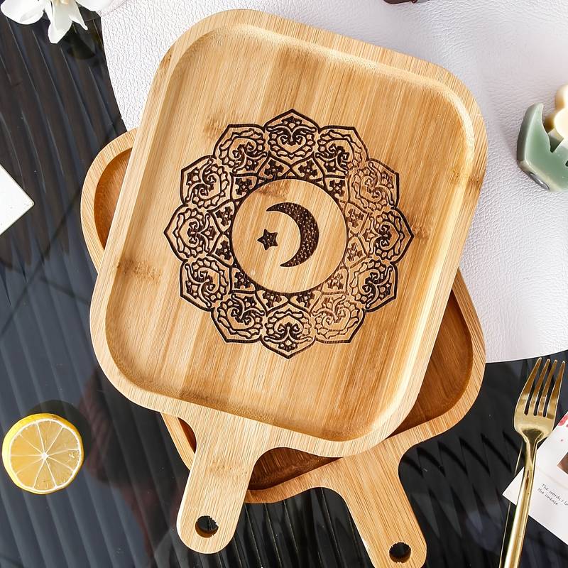 <p>Impress your loved ones this Ramadan season with our themed wooden serving board! This platter is the perfect way to showcase your meats, cheese, and nibbles during everyday meals or special occasions.</p> <p>Measuring 26.5cm x 17cm, it's the ideal size for upcoming Ramadan iftars or any other events. Order now and make your next meal unforgettable!</p>