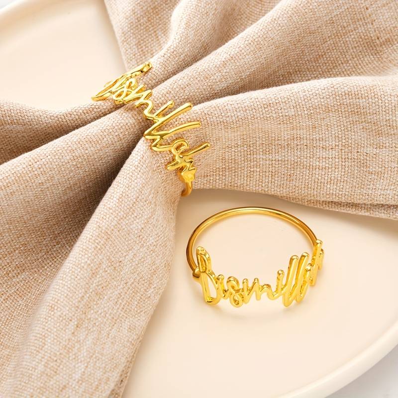 Elevate your dinner table with the exquisite Bismillah Napkin Rings. Perfect for any occasion, these rings in a stunning hue feature the word "Bismillah" in Arabic calligraphy, adding a religious and cultural touch to your dining experience. For those who appreciate the finer things in life, these napkin rings are a must-have, adding an elegant and sophisticated touch to any dinner party or special occasion.