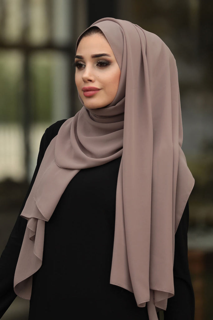 Experience the chic and weightless Chiffon Hijabs that elevate your look to new heights, no matter the occasion. The lightweight fabric drapes effortlessly, giving you that perfect summer look you desire. Explore our vast collection of colours today and elevate your style with confidence!