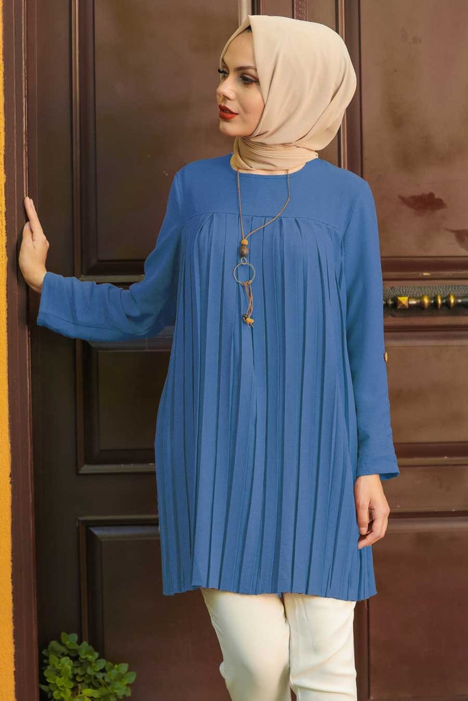 Look to this floaty plain tunic top for your favorite jeans. It features a pleated bodice with full-length sleeves and completes with a rear button fastening. Style with denim and heeled boots for an effortless glam look.   The relaxed fit is the perfect outfit for your daily chores, casual outing, or a comfy tunic dress for your everyday look. 