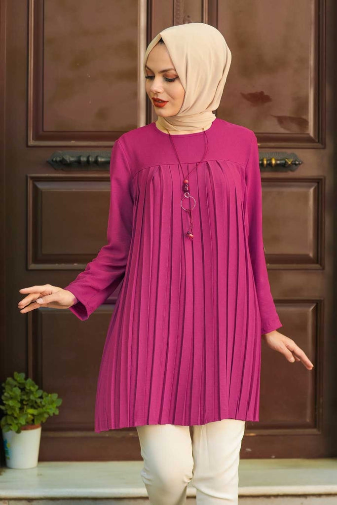 Look to this floaty plain tunic top for your favourite jeans. It features a pleated bodice with full-length sleeves and completes with a rear button fastening. Style with denim and heeled boots for an effortless glam look.   The relaxed fit is the perfect outfit for your daily chores, casual outing, or a comfy tunic dress for your everyday look. 