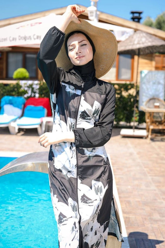 Our elegant new Aiza swimsuit offers a flattering fit-and-flare style, with a floral design and front zip opening. The full swimsuit comes complete with matching swim leggings and a turban swim cap/hijab.
