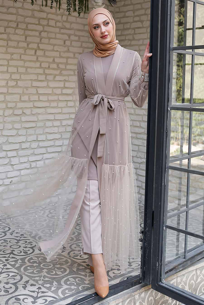This unique full-length front open style abaya is classy with elegance. Kimono-style abaya takes the simplicity to the next level with minimalistic beaded glamour on the shoulder with a sheer overlay fabric. You can't go wrong with this abaya when simplicity is on point in your closet. 