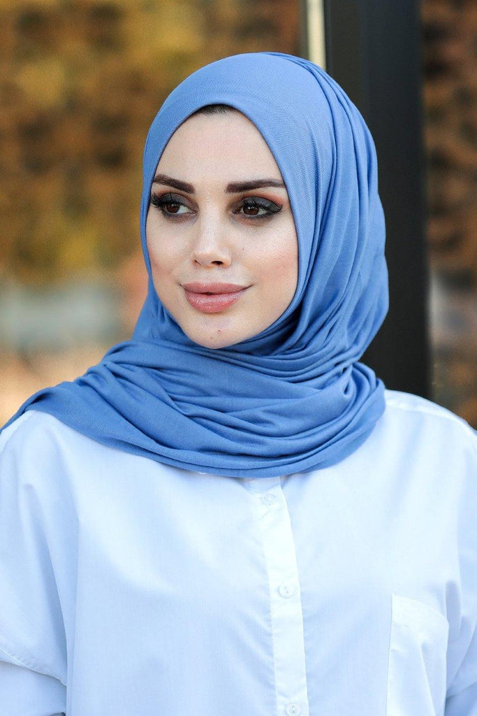 Our soft, stretchy Premium Jersey Hijabs are effortless to style and outrageously comfortable to wear. The perfect go-to hijab! Super-soft, effortless, and durable enough to last. It's breathable, fully opaque, and Jersey works well in all climates, can be worn without an underscarf or pins, and makes a great option for working out. Comes in a selection of colors ideal to finish off any look.
