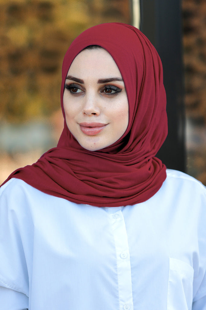 Our soft, stretchy Premium Jersey Hijabs are effortless to style and outrageously comfortable to wear, with a subtle sheen that adds polish to your look. The perfect go-to hijab! Super-soft, effortless, and durable enough to last. It's breathable, fully opaque, and Jersey works well in all climates, can be worn without an underscarf or pins, and makes a great option for working out. Comes in a selection of colors ideal to finish off any look.