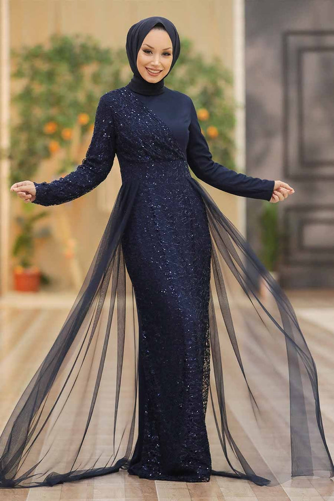 Zareen Ocasion Dress is accented with sparkly sequins all over the dress. It’s cut to a body-skimming silhouette with long sleeves and a double-layer skirt to accentuate your look. This luxurious, figure-flattering gown is the perfect fit for wedding guests, bridesmaids, engagement ceremonies, and much more.  The unique pattern has an attached veil that accentuates your look to the next level, it's the dress where a second look is guaranteed no matter where ever you go. 